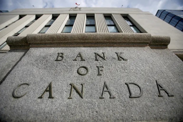 Bank of Canada cuts interest rate, warns of US tariff impact